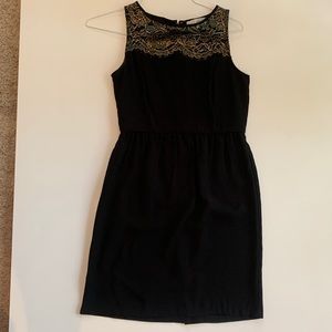 Loft black dress. Gold lace detail on front. Gold zipper in back. Size 2. LOFT